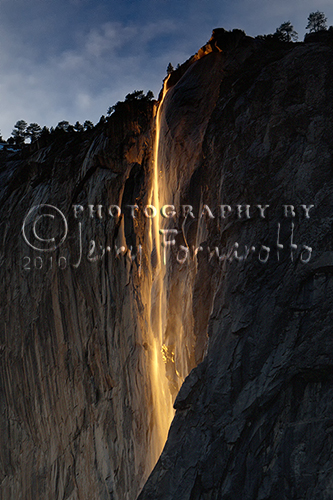 Horsetail Fall is a waterfall that flows over the edge of El Capitan in Yosemite Valley. For two weeks in February, the setting sun striking the waterfall creates a deep orange glow that resembles Yosemite's historic "Firefall."