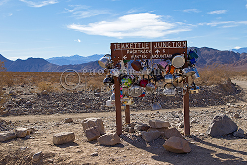 Teakettle Junction is in Death Valley National Park, near the Racetrack Playa, and Ubehebe Crater. At the junction there is a sign reading "Teakettle Junction," with many teakettles that visitors have attached to it.