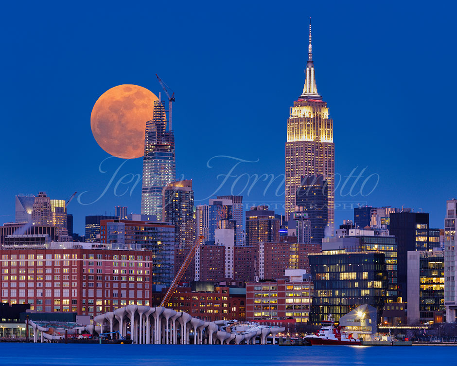 Supermoon is rising over midtown Manhattan, NYC, New York.
