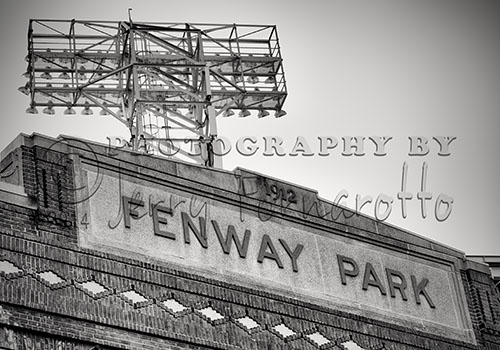 A black and white photo of the pediment of Fenway Park facing Yawkey Way, Boston Massachusetts.