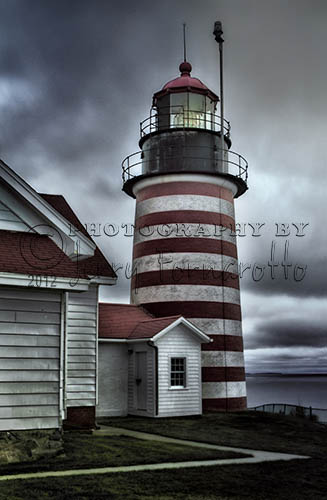 West Quoddy Head Lighthouse is the most eastern point of the contiguous U.S.. West Quoddy Lighthouse overlooks the strait between the U.S. and Canada and guide ships with a blinking white light. This red and white striped light was built in 1806.