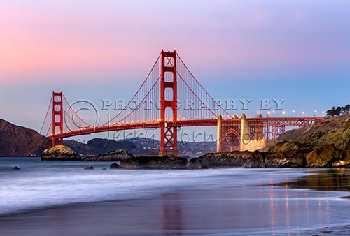 The Golden Gate Bridge spans the Golden Gate Strait between San Francisco and the Pacific Ocean. This suspension bridge is 1.7 miles long and 90 feet wide. The two towers reach 746 feet above the water. Baker Beach is public beach and is part of the Golden Gate National Parks Conservancy.
