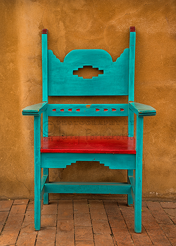 A photo of a vividly painted chair found in Oldtown section of Alburquerue, New Mexico.