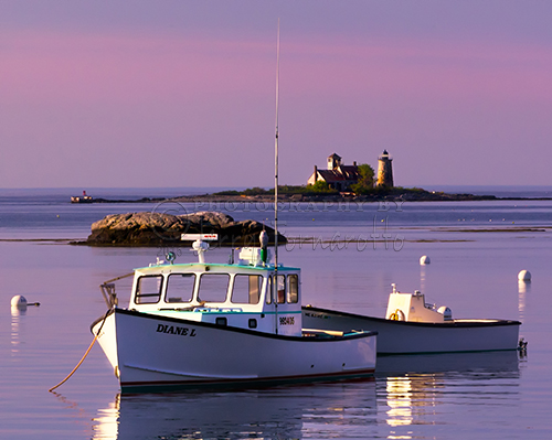 The sunrise view looking towards the Atlantic Ocean from Kittery Point, Maine. Whaleback Light and Wood Island Life Boat Station marks the entrance to the Piscataqua River.
