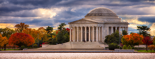 This is a panoramic color photo of the Jefferson Memorial in Washington D.C.. The memorial is located on the shore of the Potomac River Tidal Basin. The photo was taken on a stormy fall morning.