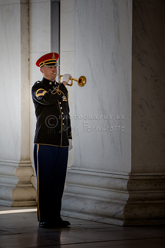 A marine playing "Taps" at the Jefferson Memorial in honor of his birthday, April 13, 1743.
