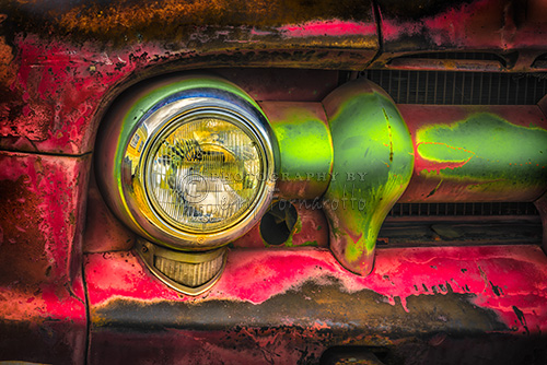 A HDR photo of a GMC 350 Truck grill and headlight.