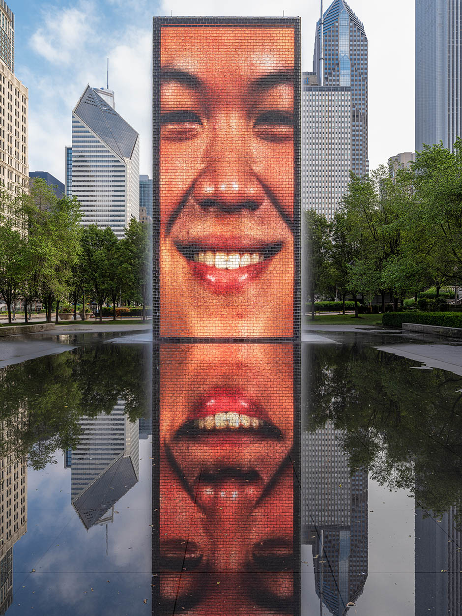 Crown Fountain is an interactive work of public art and video sculpture featured in Chicago's Millennium Park, which is located in the Loop community area. Designed by Catalan artist Jaume Plensa and executed by Krueck and Sexton Architects, it opened in July 2004.
