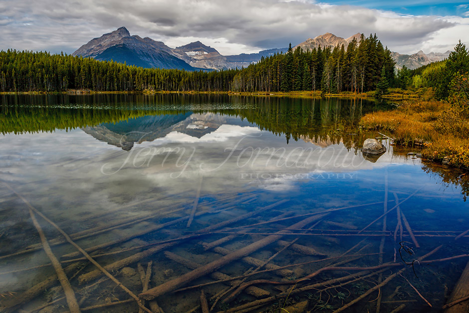 Unbeatable beauty of Banff National Park in Alberta, Canada. Herbert Lake early in the morning or during at sunset you can enjoy incredible reflection of Mt. Temple.