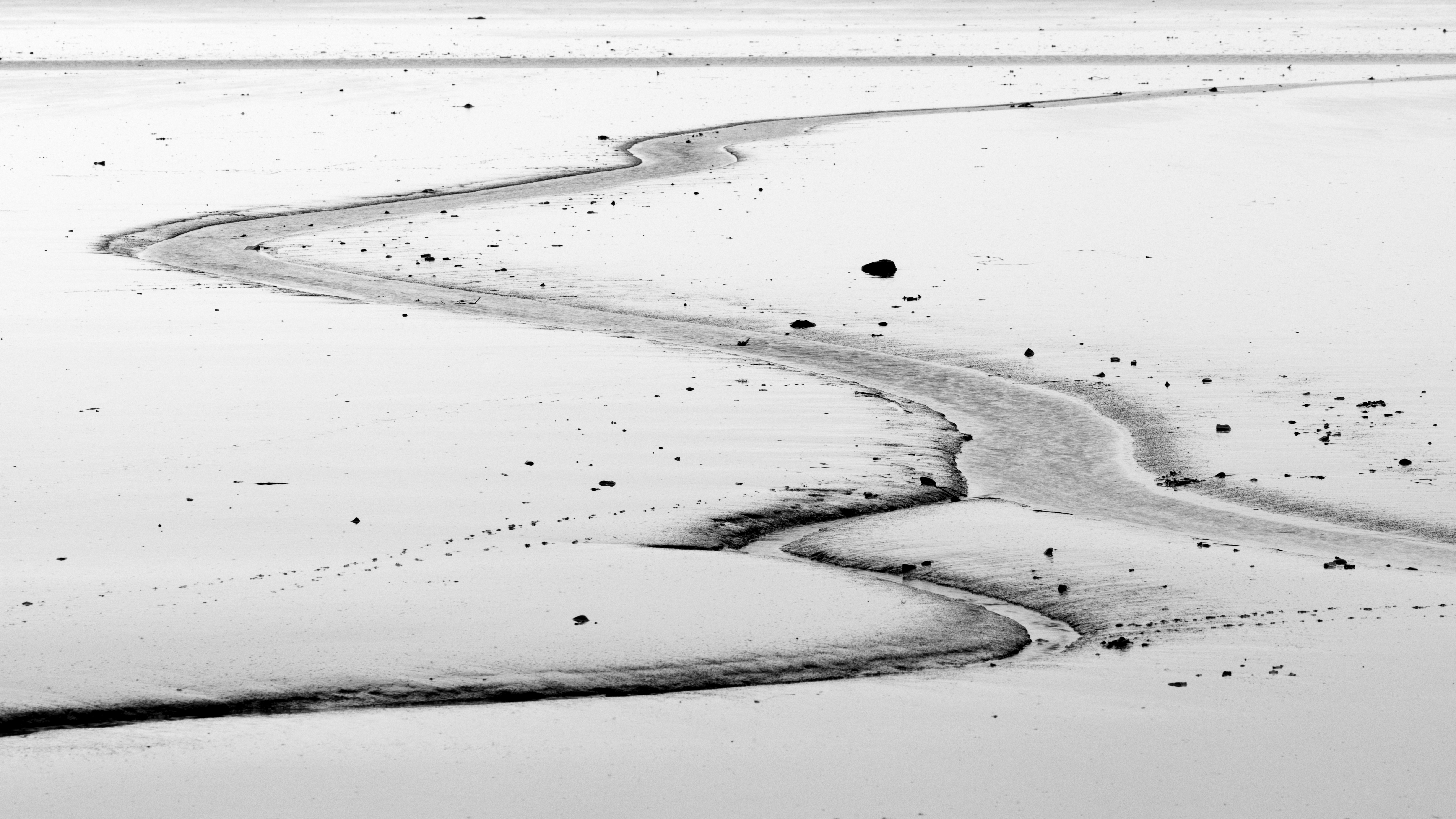 A stretch of muddy land left uncovered at low tide. stretch of muddy land left uncovered at low tide along the coast of Iceland.