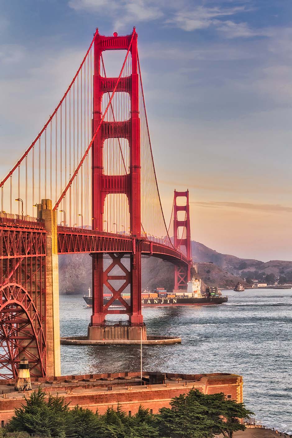 The Golden Gate Bridge spans the Golden Gate Strait between San Francisco and the Pacific Ocean. This suspension bridge is 1.7 miles long and 90 feet wide. The two towers reach 746 feet above the water.