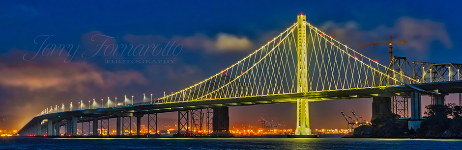 Oakland Bay Bridge also know as "Bay Bridge", spans the San Francisco Bay.