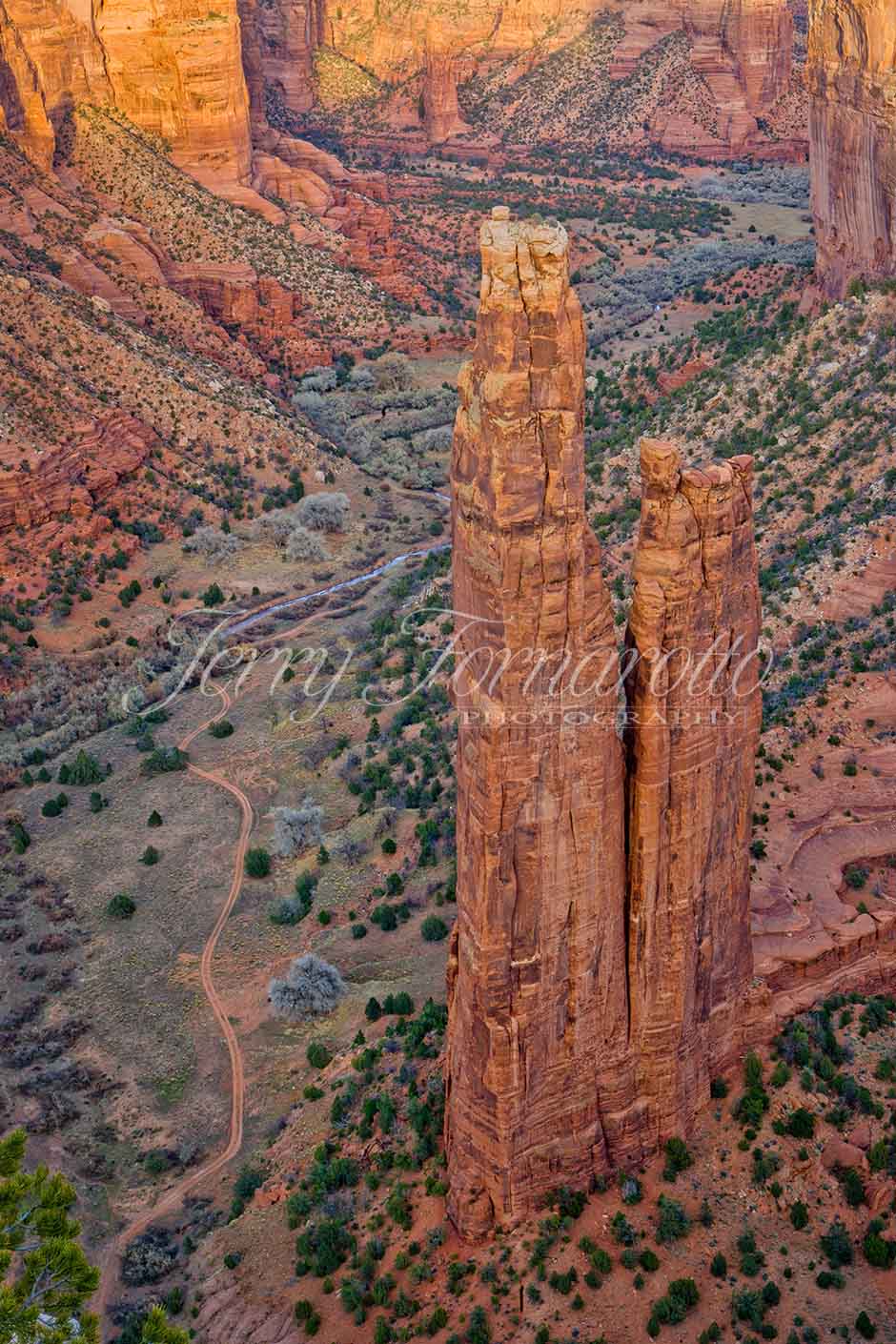 The park's distinctive geologic feature, Spider Rock, is a sandstone spire that rises 750 feet (229 m) from the canyon floor at the junction of Canyon de Chelly and Monument Canyon. Spider Rock can be seen from South Rim Drive. It has served as the scene of a number of television commercials. According to traditional Navajo beliefs the taller of the two spires is the home of Spider Grandmother.